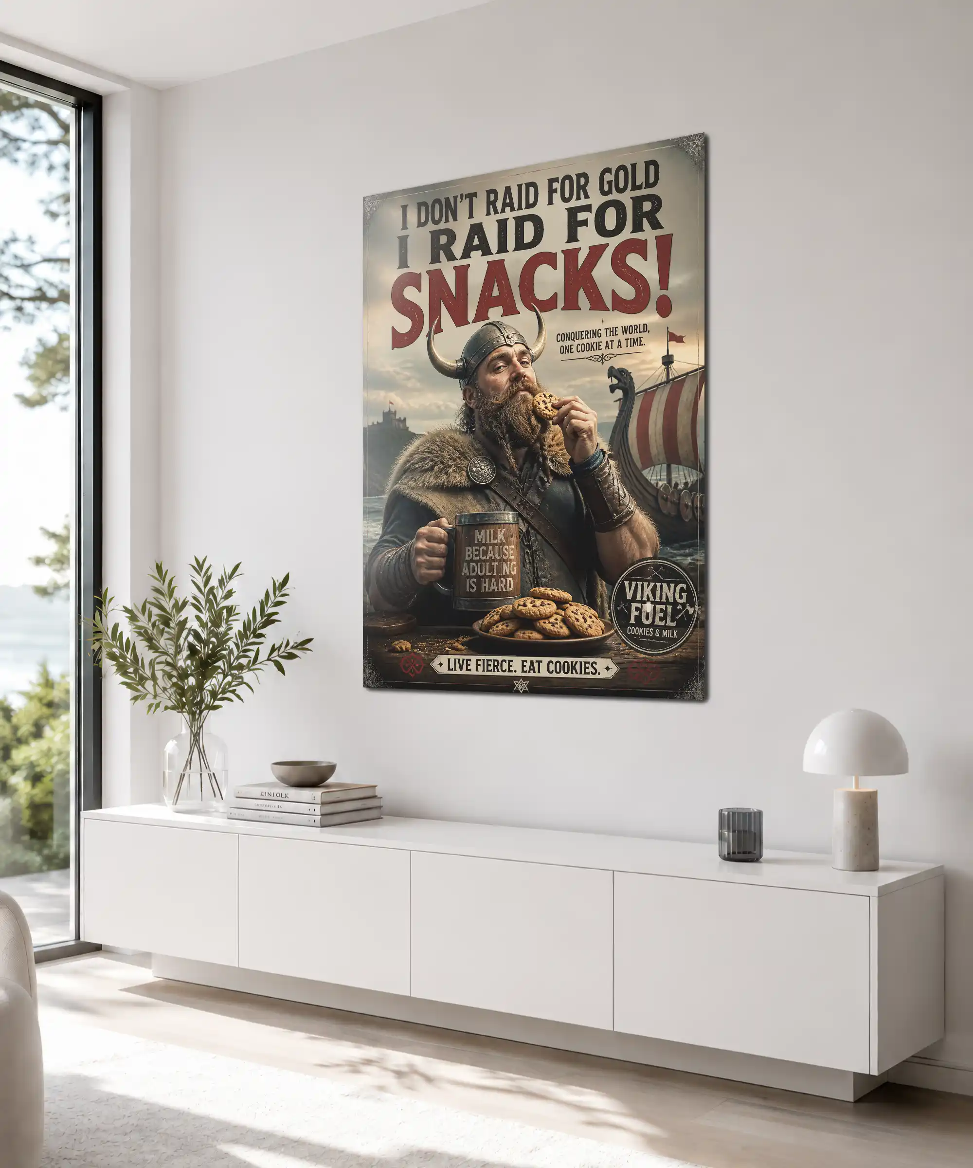 Snack Raid Viking Poster 4 painting Angled framed Viking cookie wall art in a cozy room, featuring humorous Viking and cookie-themed typography